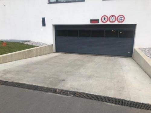 a garage with two clocks on the side of a building at Apartmantplus01 in Prague