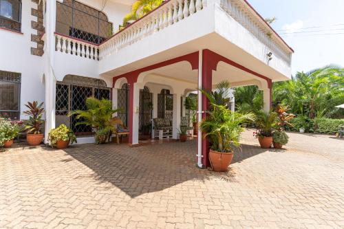 a courtyard of a house with potted plants at Bonsai Villa in Nairobi