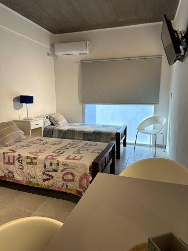 Ένα ή περισσότερα κρεβάτια σε δωμάτιο στο Temporarios Gemelli 1D - 2D