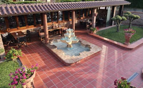 an aerial view of a patio with a fountain at Drini Hotel in Durrës