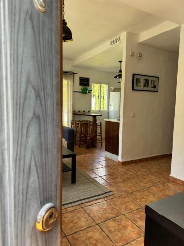 a door to a kitchen and a living room at Caños de Meca, Luz de Luna in Los Caños de Meca