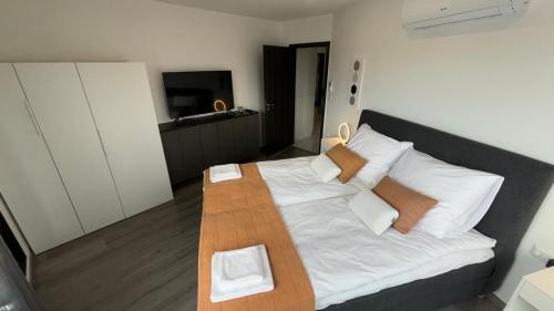 Cama o camas de una habitación en Natasa Apartman