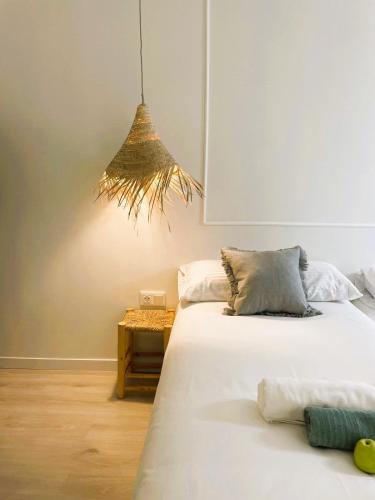 a bedroom with two beds and a table at COLLECTION PORT - B&B Boutique , Alicante Center in Alicante