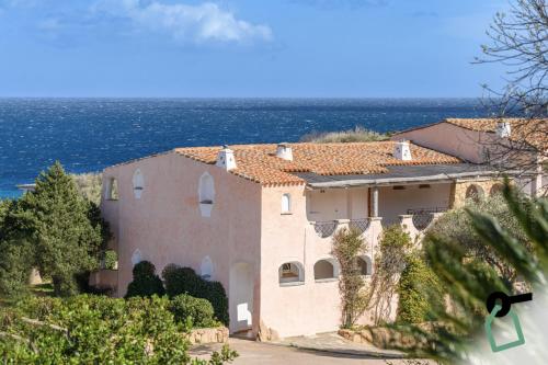 a house with a view of the ocean at Hotiday Room Collection - Porto Cervo in Porto Cervo