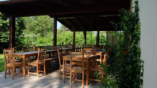 a group of tables and chairs on a patio at Polani - Il Noceto in Cave