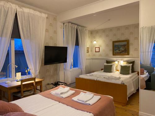 Postel nebo postele na pokoji v ubytování Borgs Villahotell och B&B