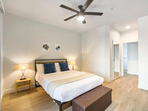 a bedroom with a bed with a ceiling fan at 2BR Kierland Commons Golf Oasis by CozySuites! in Scottsdale
