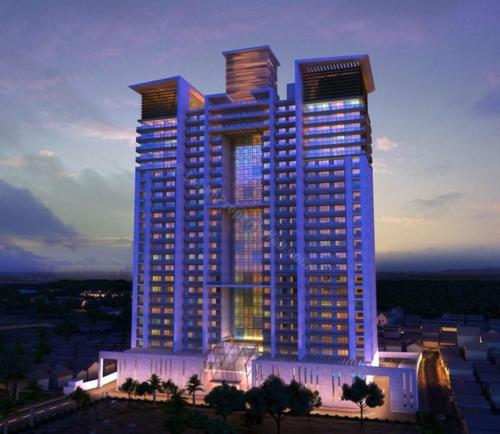 un gran edificio con luces azules delante de él en 3 Bedroom Apartment - Iconic Residences Colombo en Sri Jayewardenepura Kotte