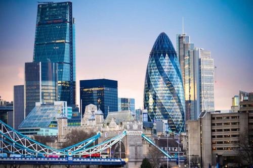 a city skyline with a bridge and many tall buildings at CENTRAL WEST END & THEATRE-LAND 2 Beds & 2 Baths in London