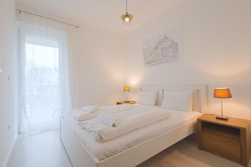 Säng eller sängar i ett rum på Casa Mimoza Apartman By BLTN Balatonföldvár