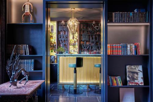 a room with a table and some books at Juliana Hotel & Spa - Brussels Centre in Brussels