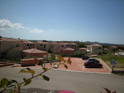 a car parked in a parking lot in a house at Mare & Mirice - Case Appartamenti Vacanza in Aglientu