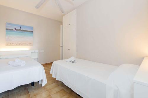 Ένα ή περισσότερα κρεβάτια σε δωμάτιο στο Siesta Mar Confort