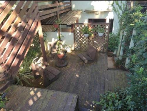 an aerial view of a patio with potted plants at Estúdios Mangueiras in Florianópolis