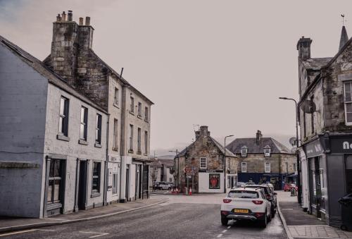 a car parked on a street in a town at The Kinross Residence in Kinross
