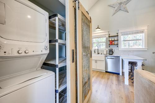 a kitchen with a refrigerator and a counter top at Byron Getaway with Fire Pit - Near MGA and Mercer! in Byron