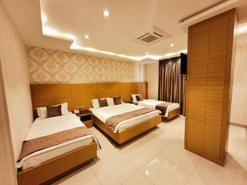Krevet ili kreveti u jedinici u okviru objekta King Hotel Karbala