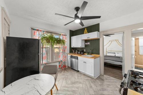 a kitchen with a table and a ceiling fan at Pet Friendly 2BR in Little Italy # 3 in Cleveland