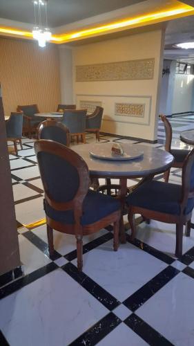 a dining room with a table and chairs at THE MARK HOTEL in Nairobi