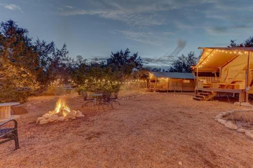 a campground with a fire pit and a tent at 12 Fires Luxury Glamping #3 in Johnson City