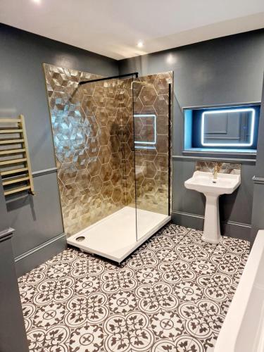 a bathroom with a shower and a sink at Hamilton-The Alexander suite luxury holiday Let's in Scorton