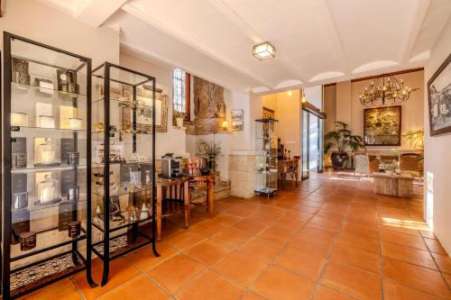 a room with glass display cases in a building at La Posada del Mar in Denia