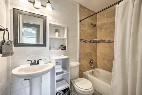 a bathroom with a sink and a toilet and a shower at Backyard Oasis! 2 mi to Pier with Pool, Patio Bar & Putting Green in Safety Harbor