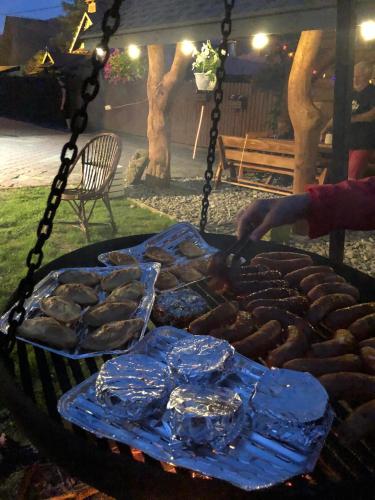 a grill with a bunch of food on it at Agroturystyka Górski Wypoczynek in Stryszawa