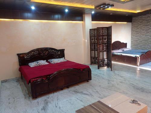 a bedroom with two beds in a room at Occasions in Jammu