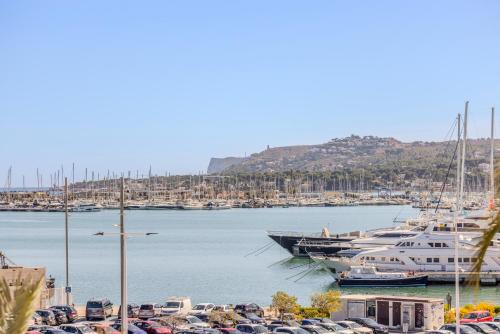 a bunch of boats docked in a marina at La Posada del Mar in Denia