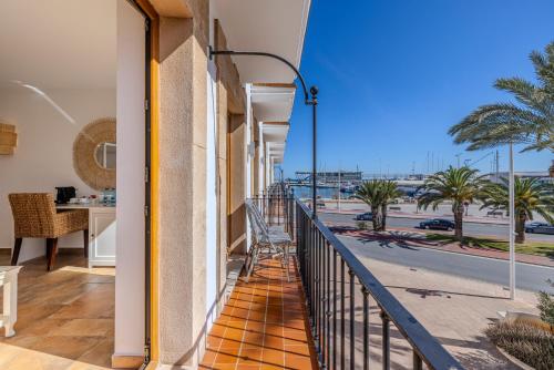 a balcony with a view of a street at La Posada del Mar in Denia