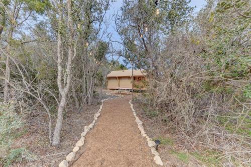 a path leading to a house in the woods at 12 Fires Luxury Glamping with AC #5 in Johnson City