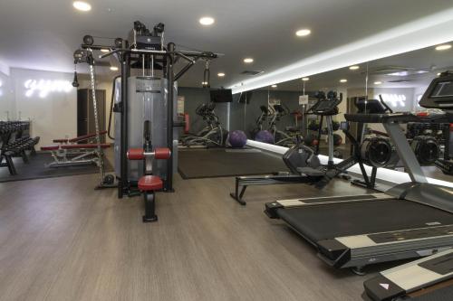 a gym with several treadmills and other equipment at OPP Exeter LH1&2 - Behind the Cathedral with free parking! BIG SAVINGS booking 7 nights or more! in Exeter