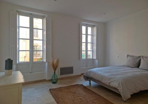 Postel nebo postele na pokoji v ubytování Appartement de charme - CARPENTRAS - Rendez-vous en Provence