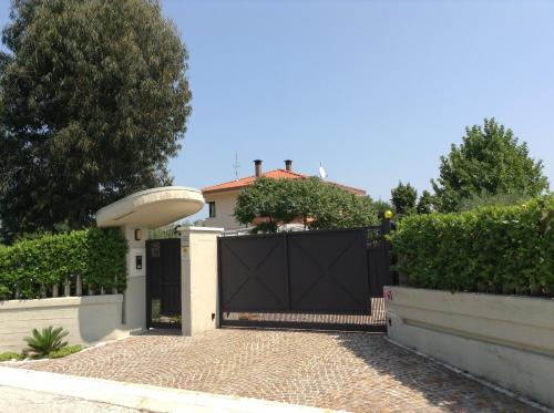 a black gate in front of a house at Villa Margherita in Montaquila