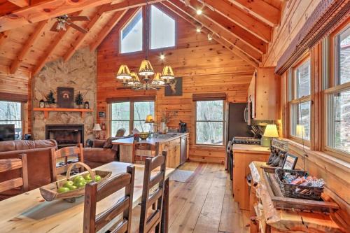 a kitchen and living room with wooden walls and ceilings at Pet-Friendly Mountain Retreat Fire Pit Hot Tub in Blue Ridge