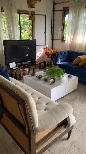 a living room with a couch and a coffee table at Finca Completa - Casa Privada - Vía Bogotá - La Mesa con WIFI - Pet Friendly in La Mesa