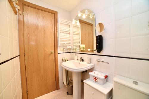 a bathroom with a sink and a mirror at El balcón de la inspiración en plena natura HUT-8434 in Encamp