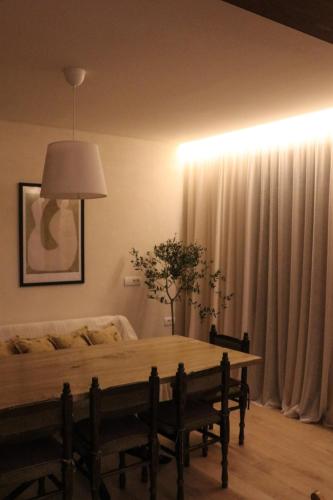 a living room with a table and a couch at Casa L in Ulcinj