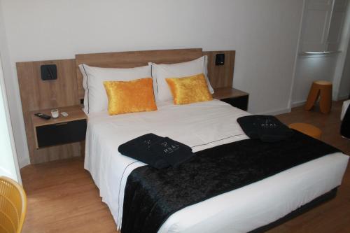 Ένα ή περισσότερα κρεβάτια σε δωμάτιο στο Real Guest House