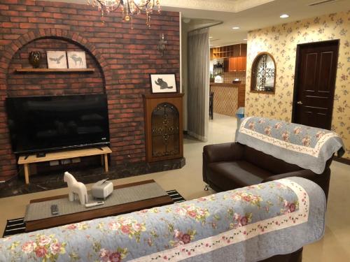 a living room with a couch and a fireplace at Bright Starry Hostel -Vacation in Donggang in Donggang