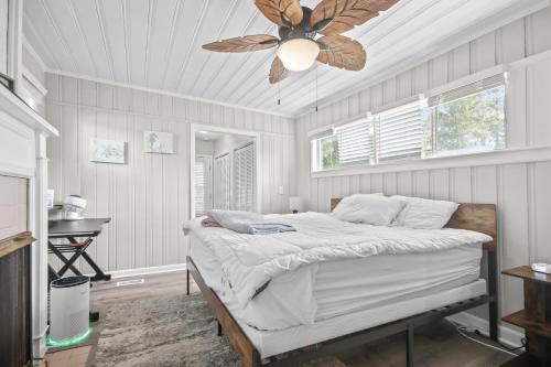 a bedroom with a bed with a ceiling fan at Quiet Oasis in Myrtle Beach