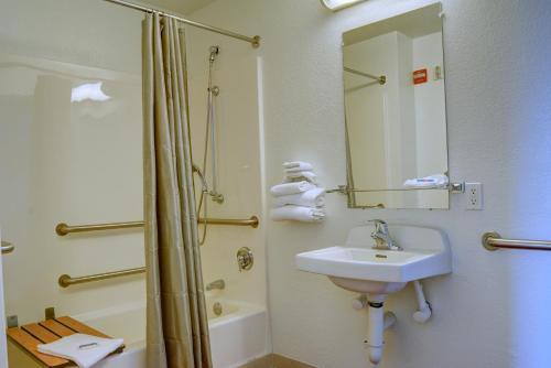 a bathroom with a sink and a shower at Motel 6-Springfield, OR - Eugene North in Springfield