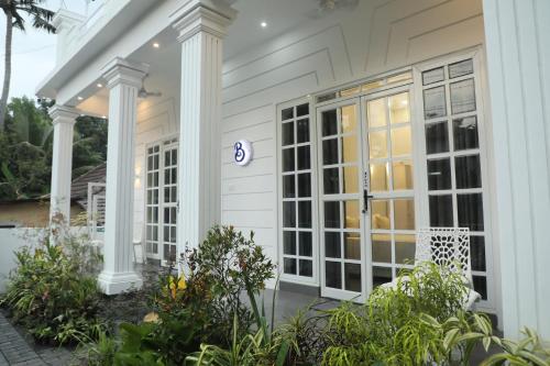 Κήπος έξω από το Beach Paradise, Bateen Beach Stay