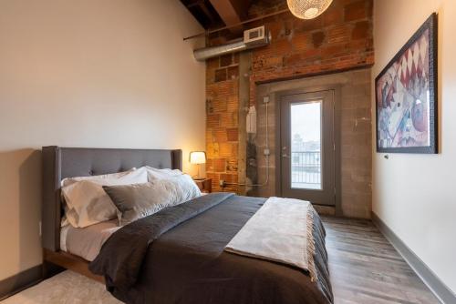 Ένα ή περισσότερα κρεβάτια σε δωμάτιο στο ABODES ApartHotel