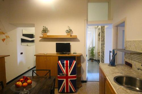 a kitchen with a table with a flag on it at La stella di Manarola- Bluchalet in Manarola