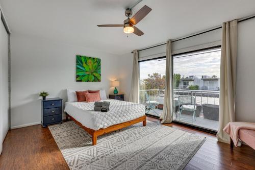 a bedroom with a bed and a balcony at 1 Mi to Old Town! Snowbird Escape with Pool Access in Scottsdale