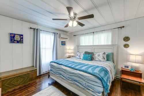 a bedroom with a bed and a ceiling fan at Cozy Texas Cottage Less Than 2 Mi to Rockport Beach! in Rockport