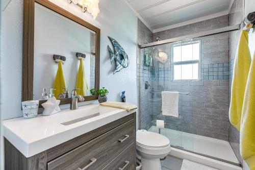 a bathroom with a sink and a shower at Cozy Texas Cottage Less Than 2 Mi to Rockport Beach! in Rockport