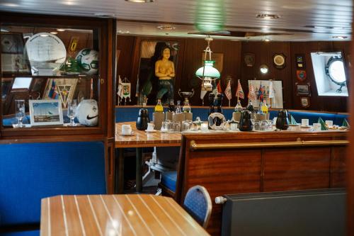 a bar on a cruise ship with a woman in the mirror at Alexander von Humboldt - Das Schiff in Bremen
